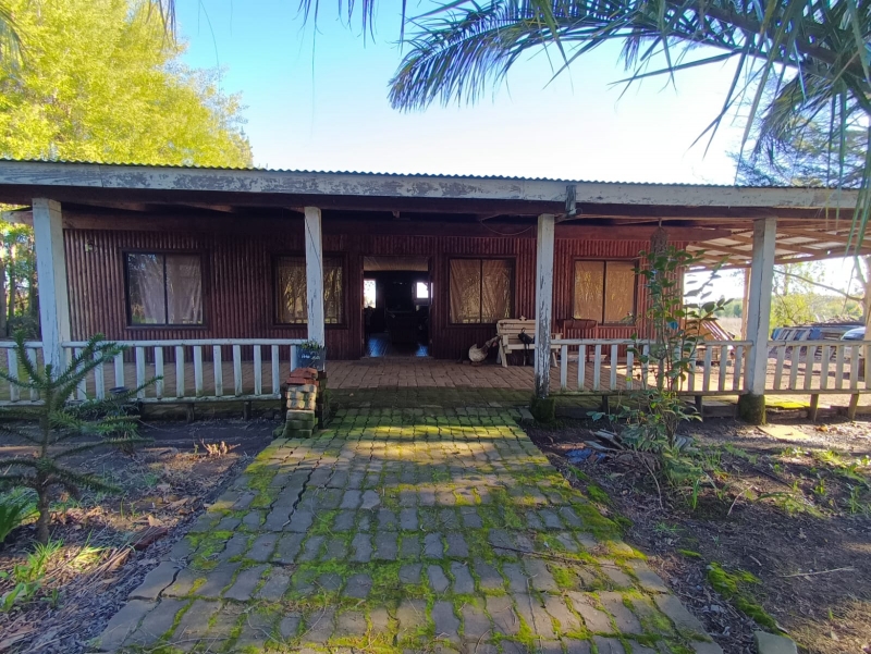 Parcela y casa parral